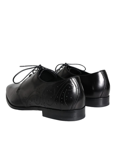 Black calfskin leather Derby men's dress shoes by Dolce & Gabbana, featuring sleek design and polished finish.