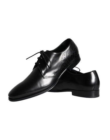 Black calfskin leather Derby men's dress shoes by Dolce & Gabbana with sleek design and polished finish.