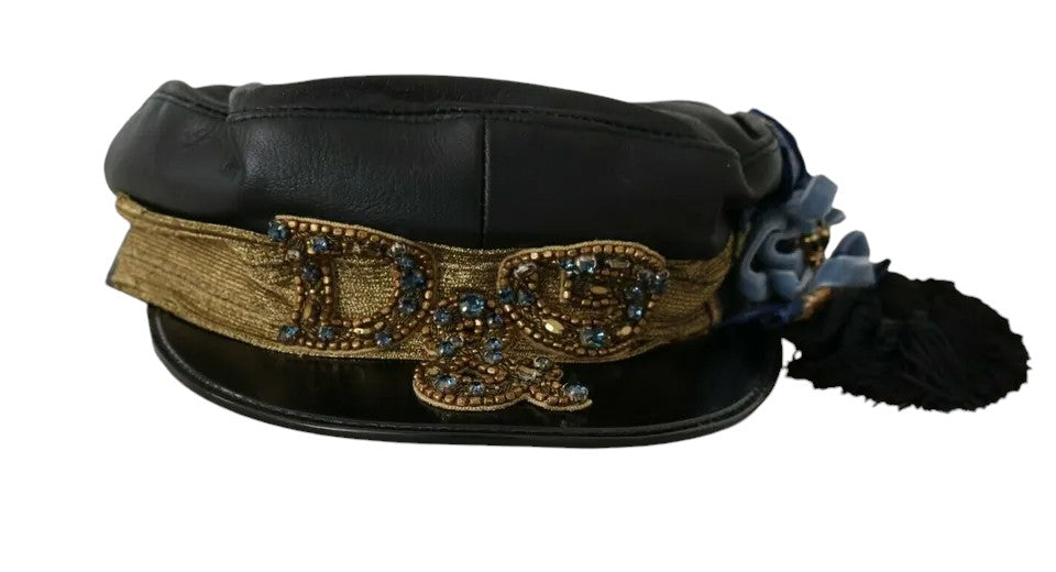 Black leather fiddler cap with crystal beads and gold ribbon, designed by Dolce & Gabbana, shown from the front view.
