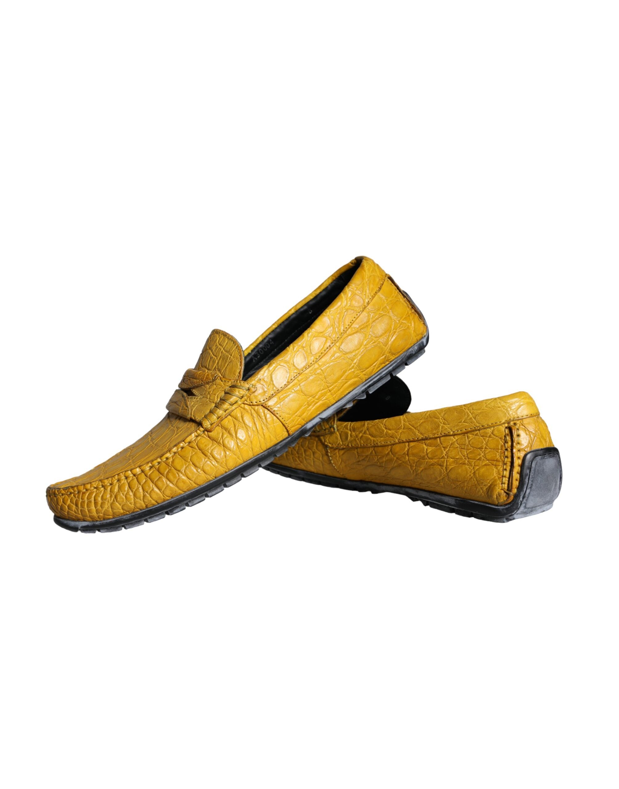 Yellow leather slip-on moccasin loafers by Dolce & Gabbana, featuring a sleek design and classic loafer silhouette.