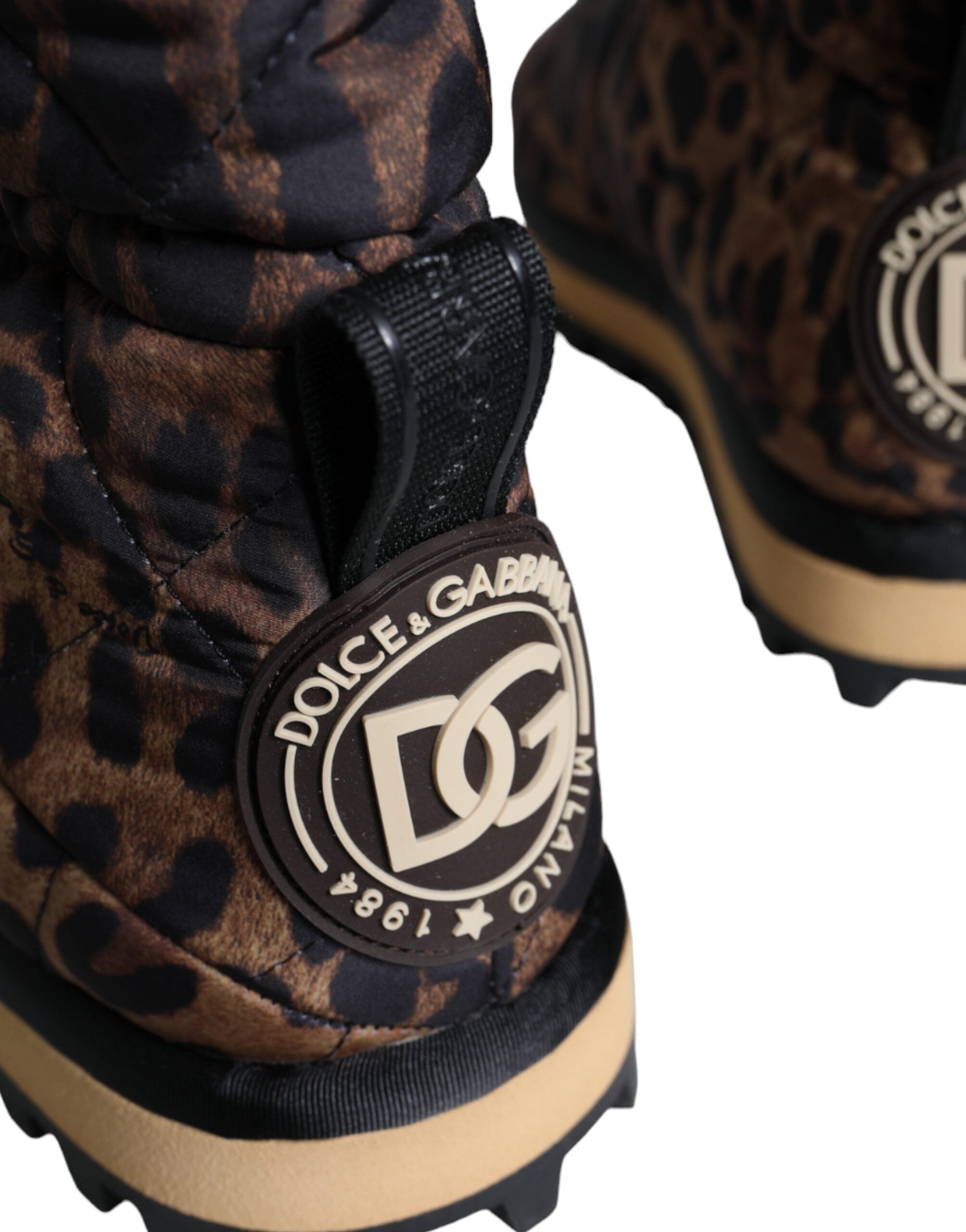 Brown leopard print ankle boots with padded shoes from Dolce & Gabbana, showcasing stylish footwear with a pointed toe and chunky heel.