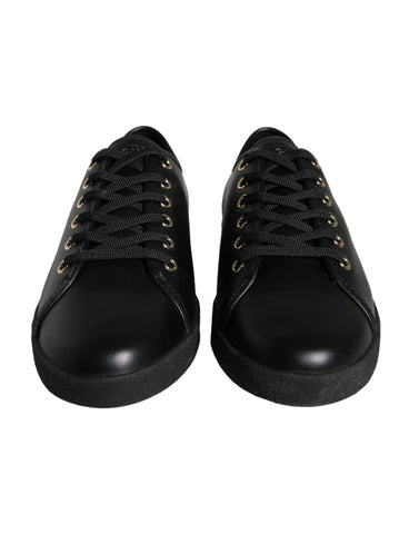 Black and gold leather Dolce & Gabbana classic sneakers with stylish design and white rubber soles.