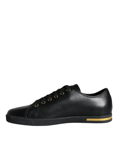 Black gold leather Dolce & Gabbana classic sneakers shoes with stylish design and textured leather upper.