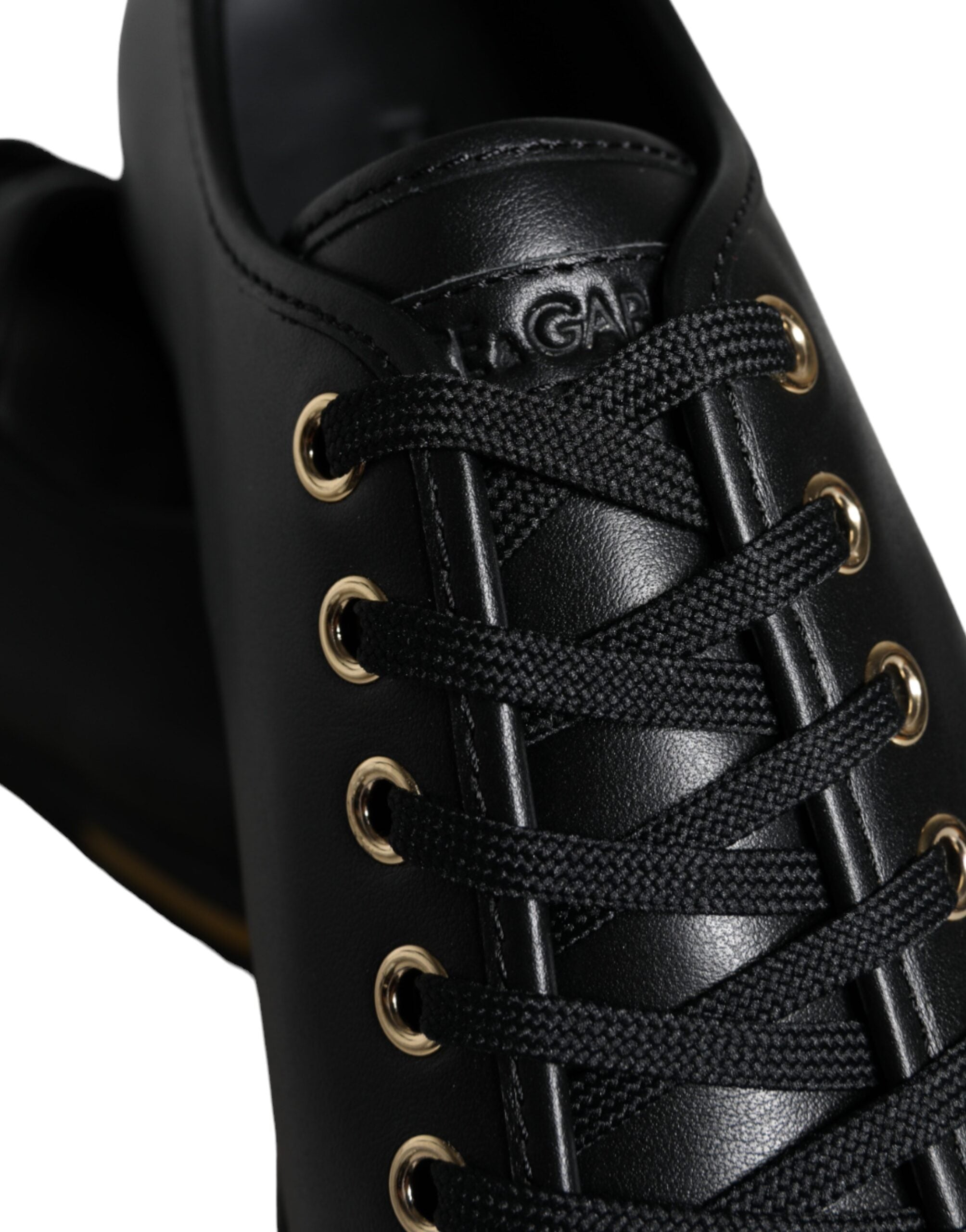 Black gold leather classic sneakers by Dolce & Gabbana, showing stylish design and textured leather upper.