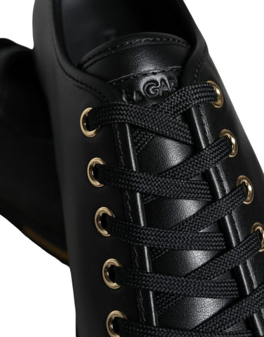 Black gold leather classic sneakers by Dolce & Gabbana, showing stylish design and textured leather upper.