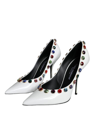 White crystal leather high heel pumps by Dolce & Gabbana, featuring sleek design and pointed toe, shown from side view.