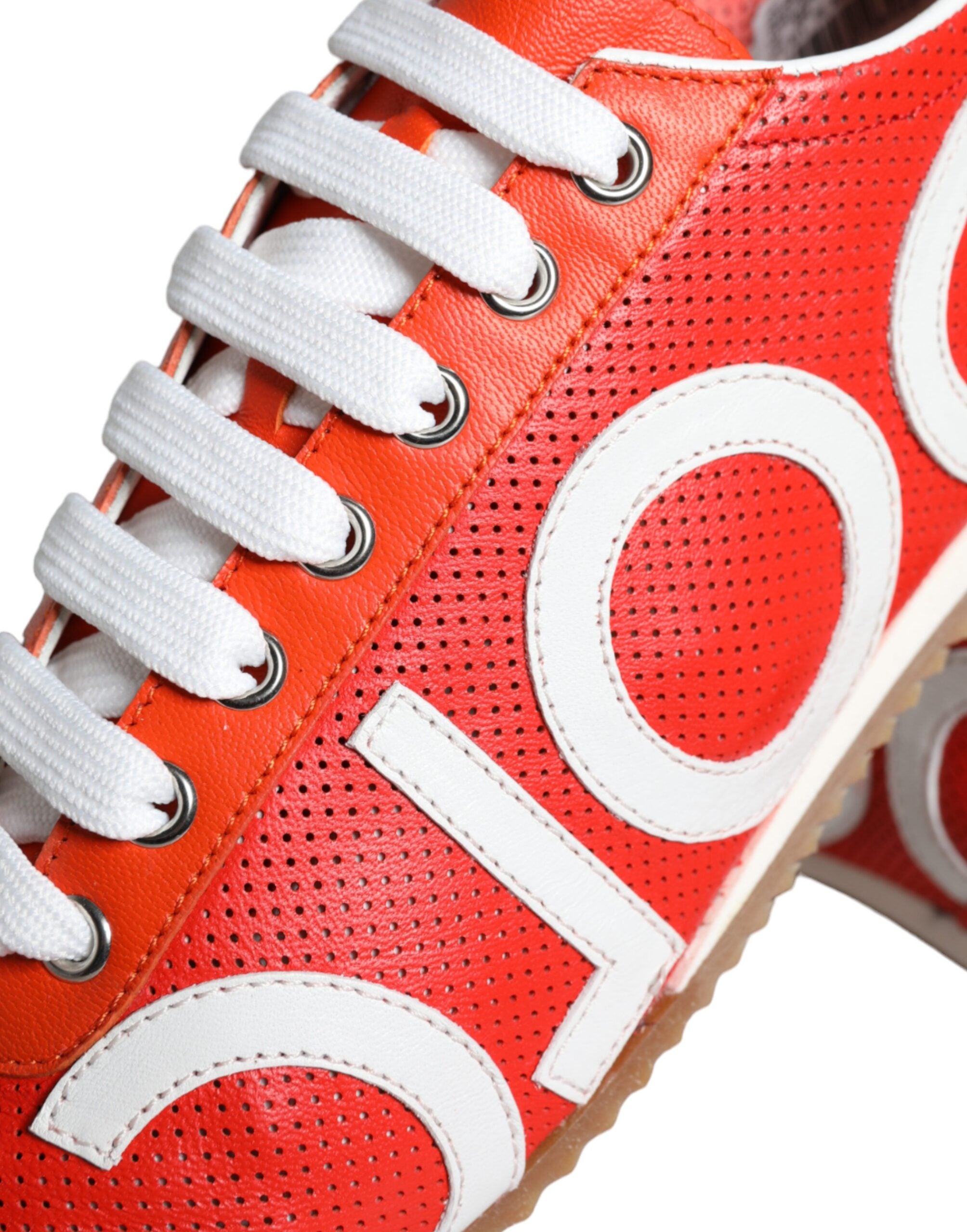 Red and white leather Dolce & Gabbana casual sneakers with logo detail, stylish and comfortable footwear for everyday wear.