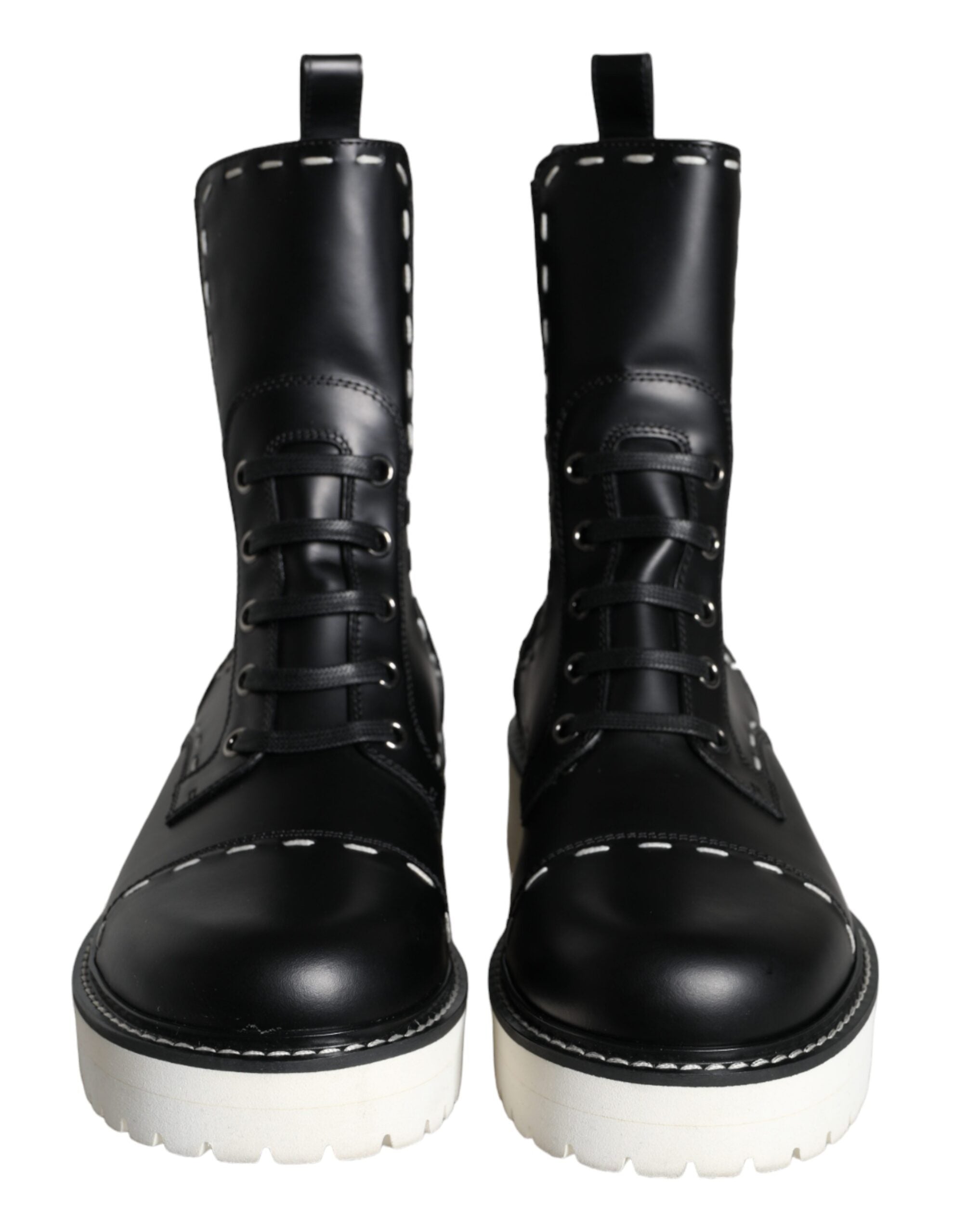 Black leather combat mid-calf boots by Dolce & Gabbana, featuring rugged design and sturdy sole for fashionable statement footwear.