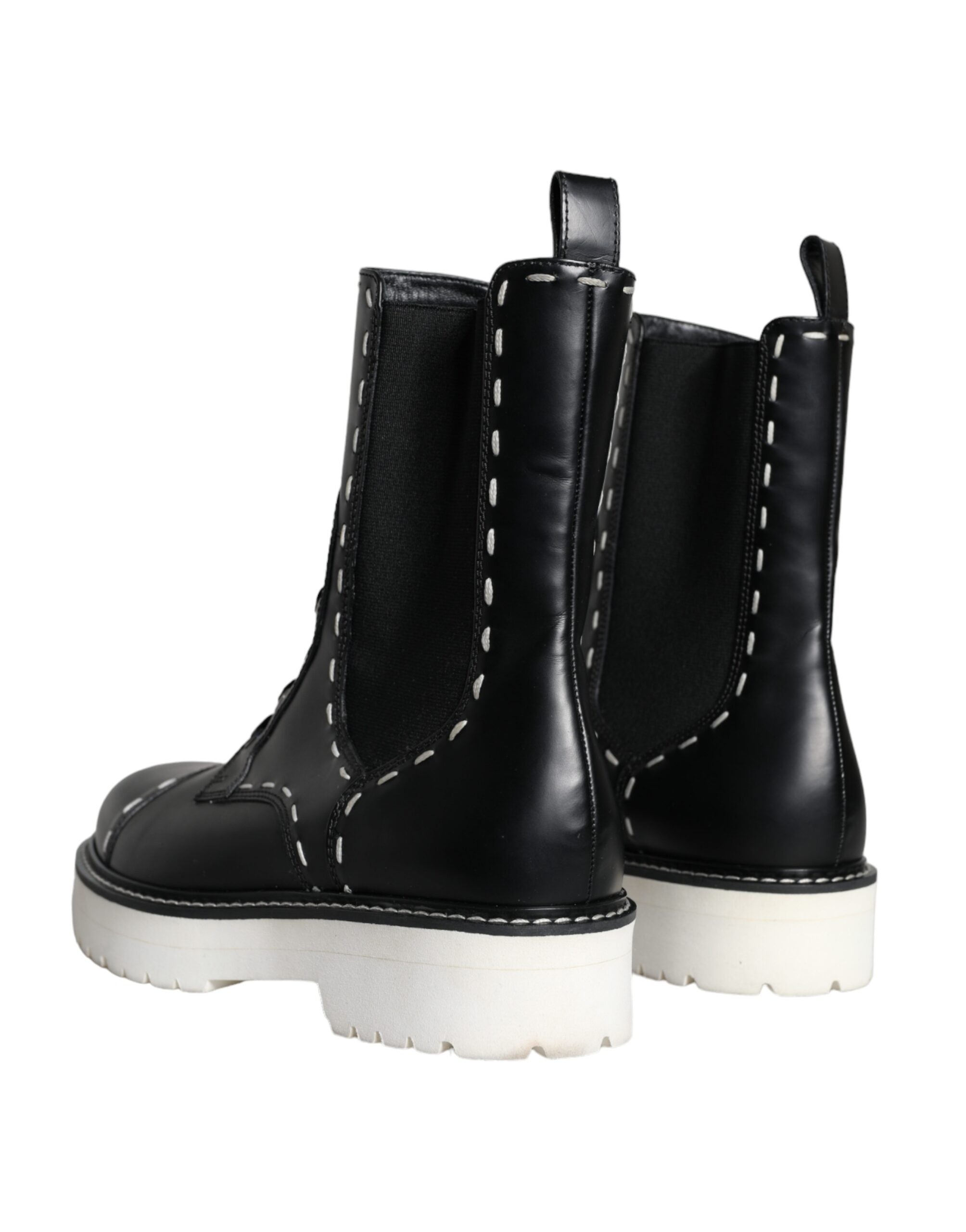 Black leather combat mid-calf boots by Dolce & Gabbana with lace-up front and sturdy sole.