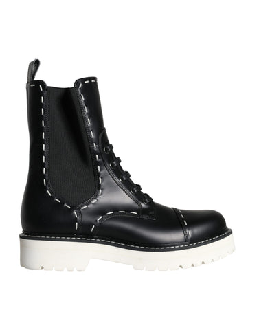 Black leather combat mid-calf boots by Dolce & Gabbana, featuring sturdy design and stylish lace-up detail.