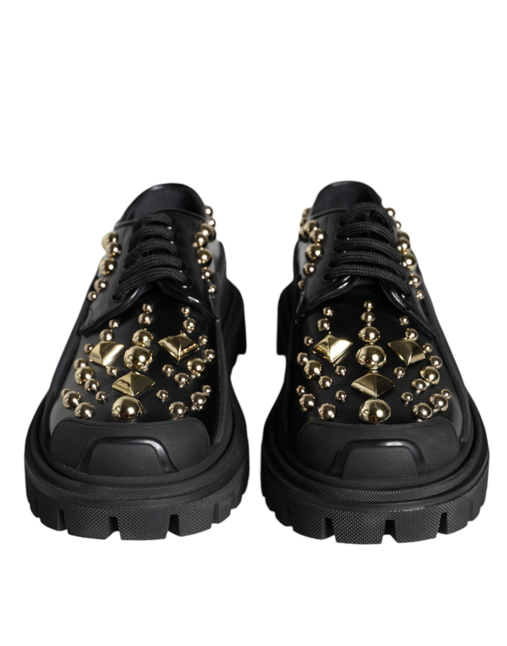Black leather trekking derby shoes with embellishments by Dolce & Gabbana, featuring a sturdy sole and elegant design.