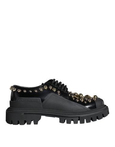 Black leather trekking derby shoes with embellishments by Dolce & Gabbana, featuring sturdy soles and detailed stitching.
