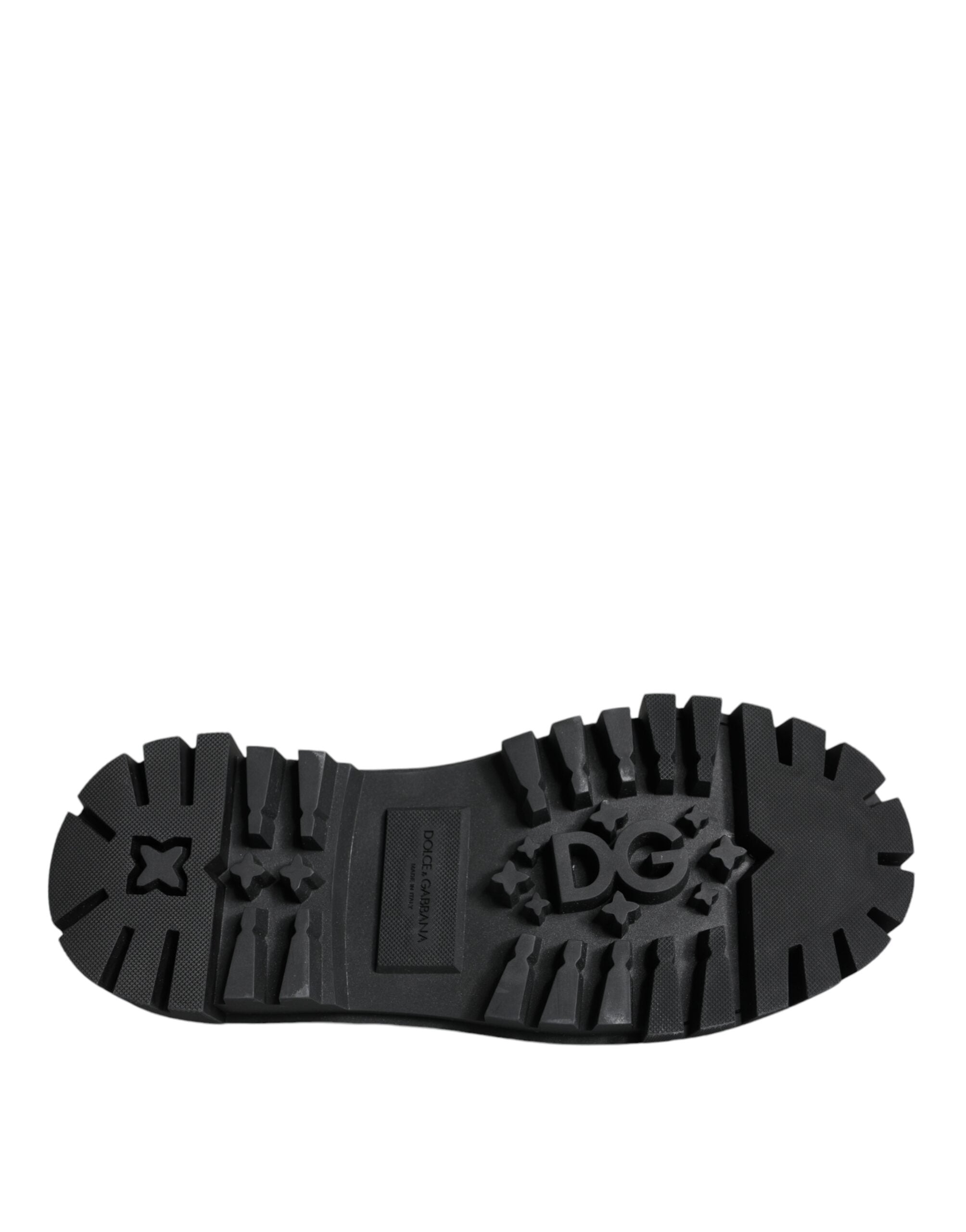 Black leather trekking derby shoes with embellishments by Dolce & Gabbana, featuring a rugged design and decorative accents.