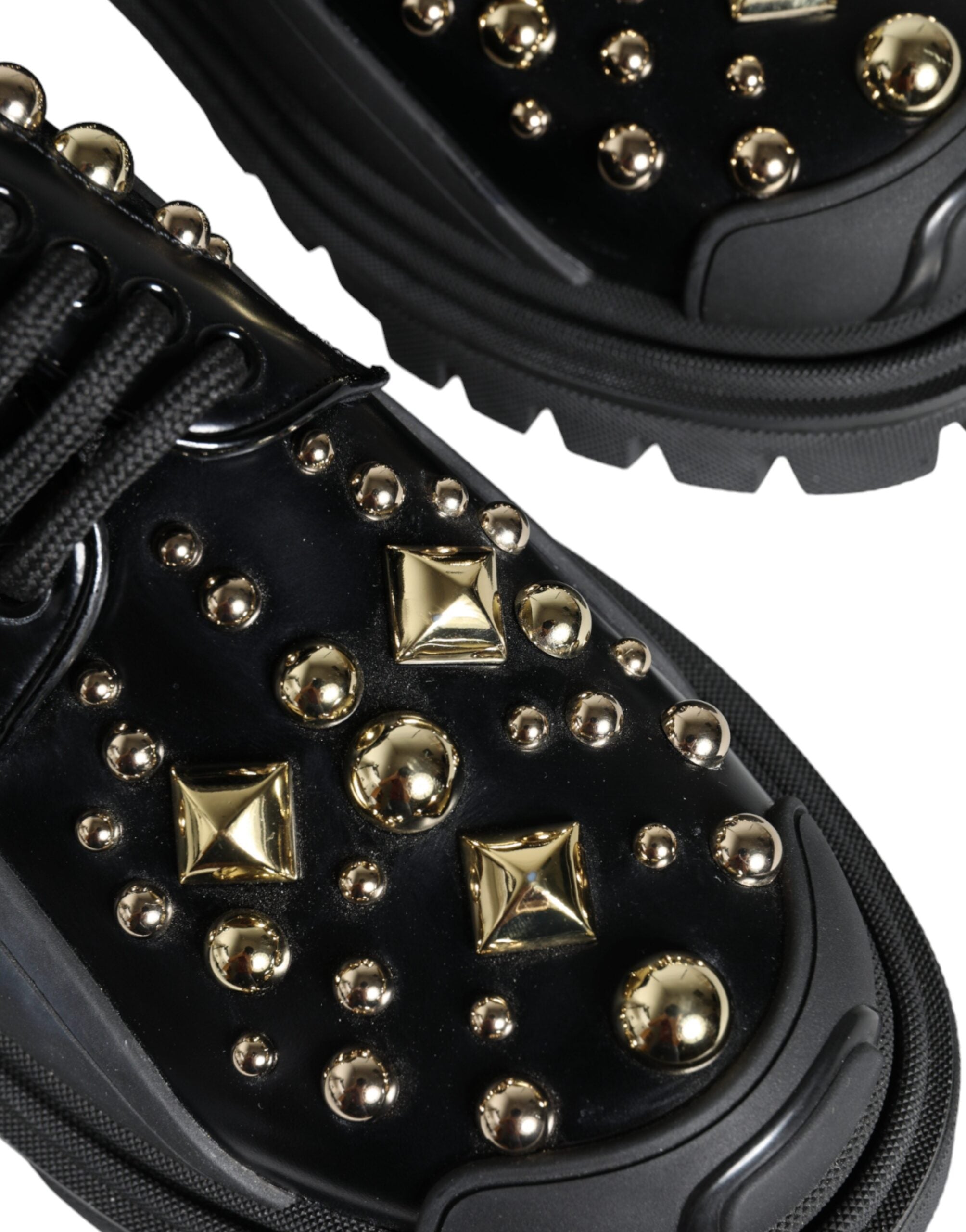 Black leather trekking derby shoes with embellishments by Dolce & Gabbana, featuring sturdy soles and stylish design.