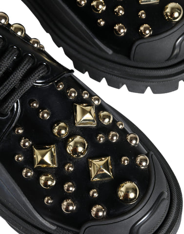 Black leather trekking derby shoes with embellishments by Dolce & Gabbana, featuring sturdy soles and stylish design.