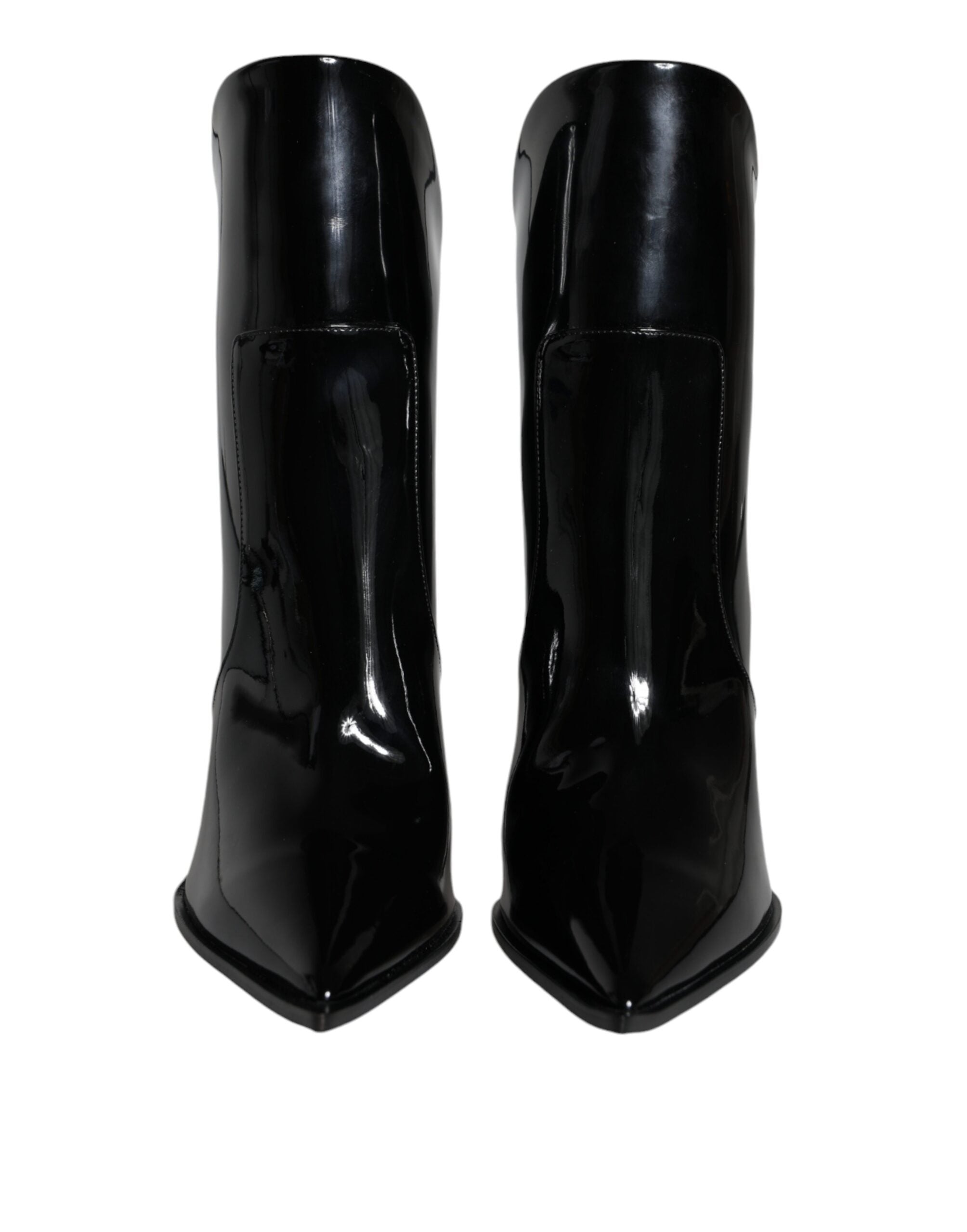 Black patent leather pointed ankle boots by Dolce & Gabbana, showcasing sleek design and stylish high-heeled footwear.
