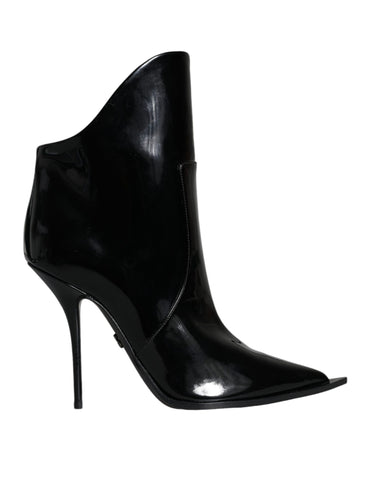 Black patent leather pointed ankle boots by Dolce & Gabbana, showcasing sleek design and stylish ankle-high cut.