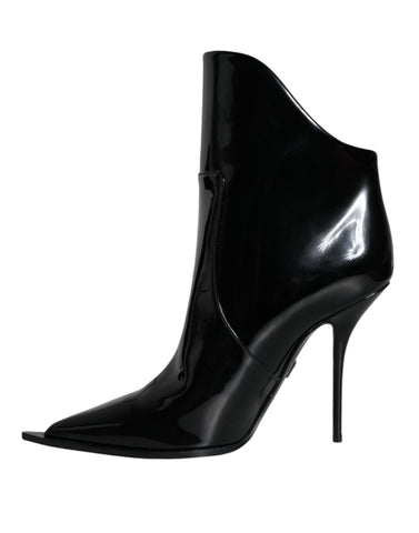 Black patent leather pointed ankle boots from Dolce & Gabbana, stylish footwear with sleek design and elegant silhouette.