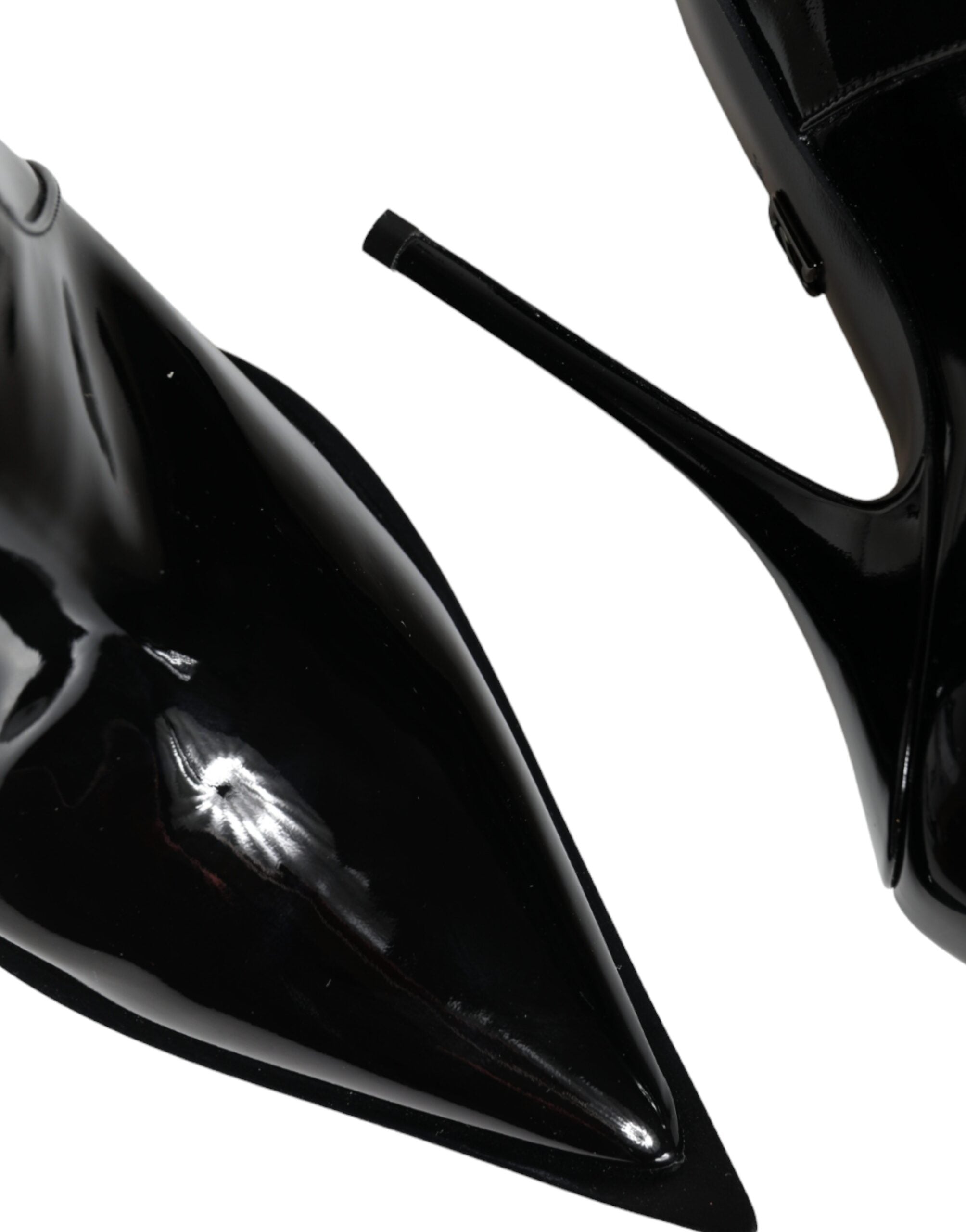 Black patent leather pointed ankle boots by Dolce & Gabbana, stylish footwear with sleek design and stiletto heel.