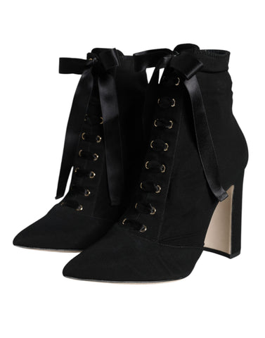 Black jersey stretch ankle booties shoes by Dolce & Gabbana, featuring sleek design and pointed toes.