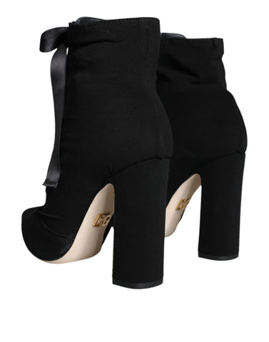 Black jersey stretch ankle booties shoes by Dolce & Gabbana with sleek design and fitted ankle coverage.