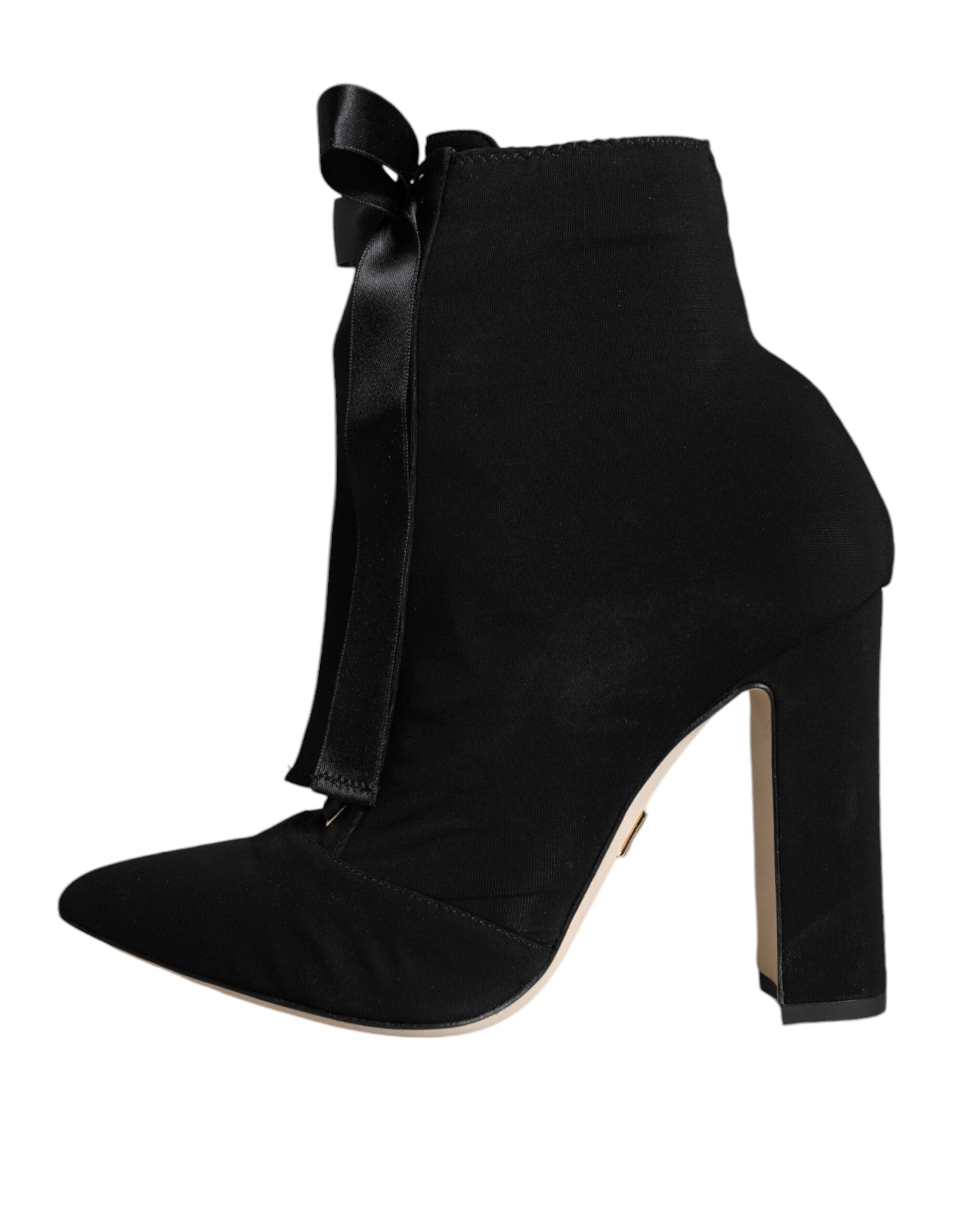 Black jersey stretch ankle booties by Dolce & Gabbana, featuring sleek design and fitted ankle length, suitable for stylish outfits.