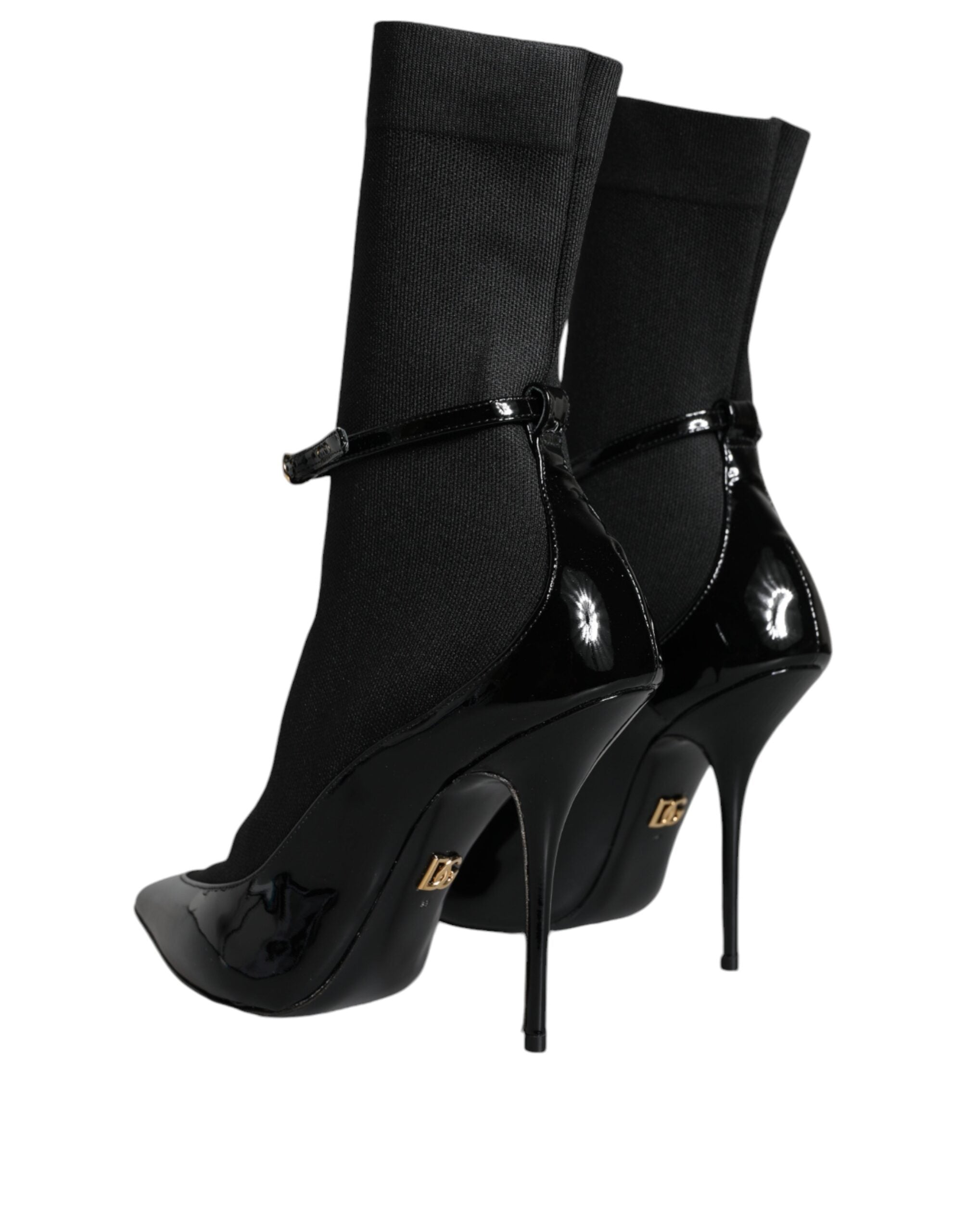 Black leather Dolce & Gabbana stiletto booties with high heels and socks-style design, stylish and sleek footwear.