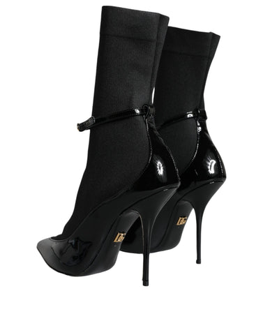 Black leather Dolce & Gabbana stiletto booties with high heels and socks-style design, stylish and sleek footwear.
