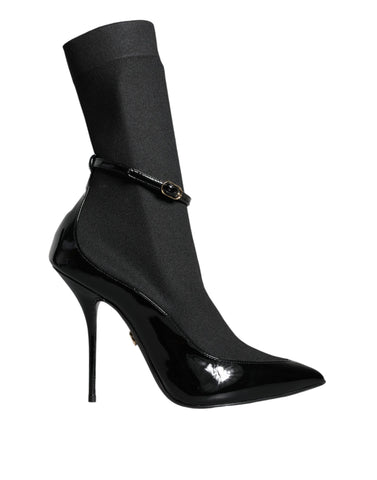 Black leather Dolce & Gabbana stiletto booties with socks, featuring pointed toes and sleek high heels.