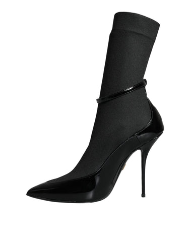 Black leather Dolce & Gabbana stiletto booties with socks design, featuring pointed toes and high heels.