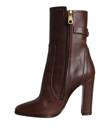 Brown leather mid-calf heels boots by Dolce & Gabbana, featuring stylish design and elegant ankle-length silhouette.