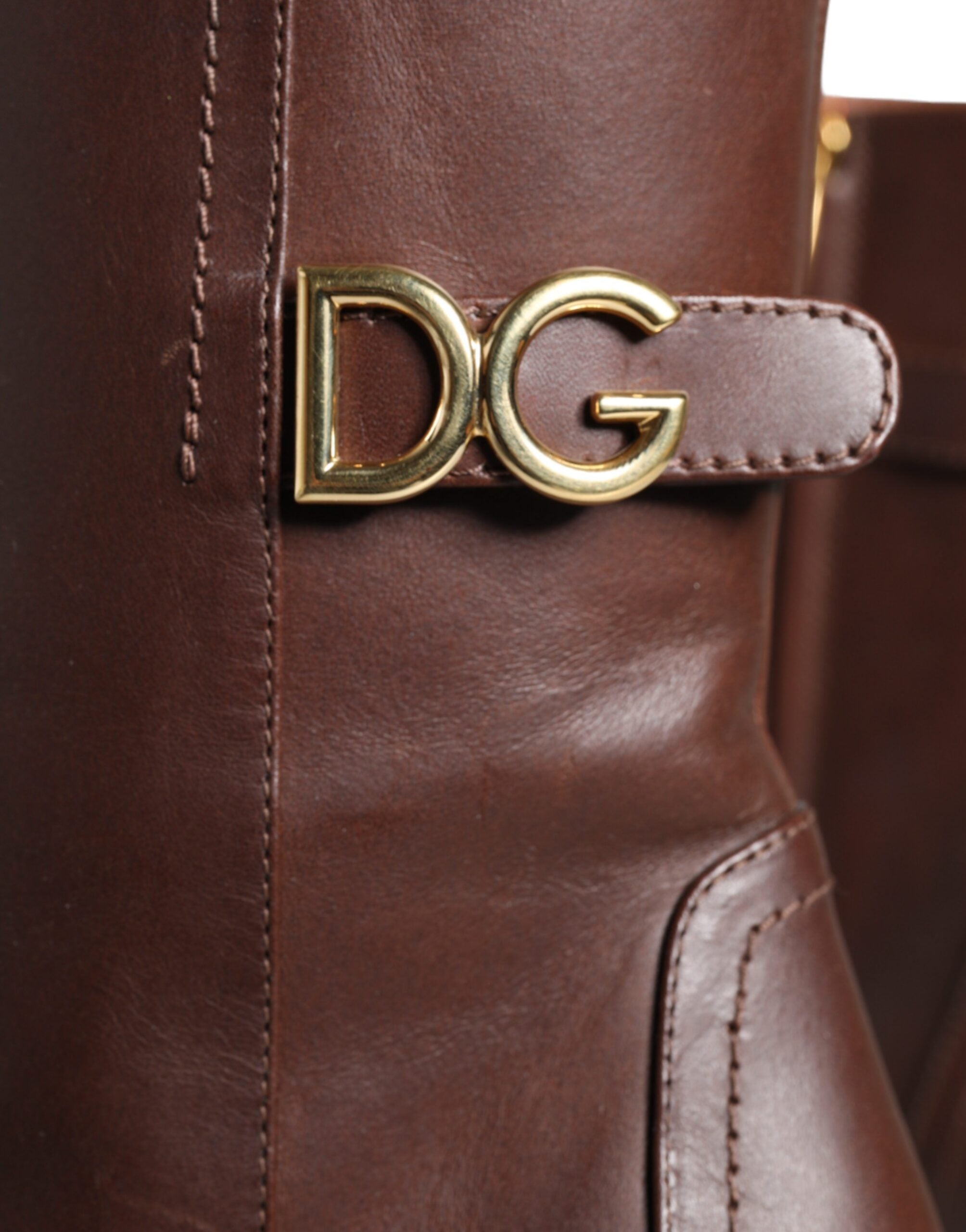 Dolce & Gabbana brown leather mid-calf heels and boots, stylish footwear with a sleek design and pointed toe.