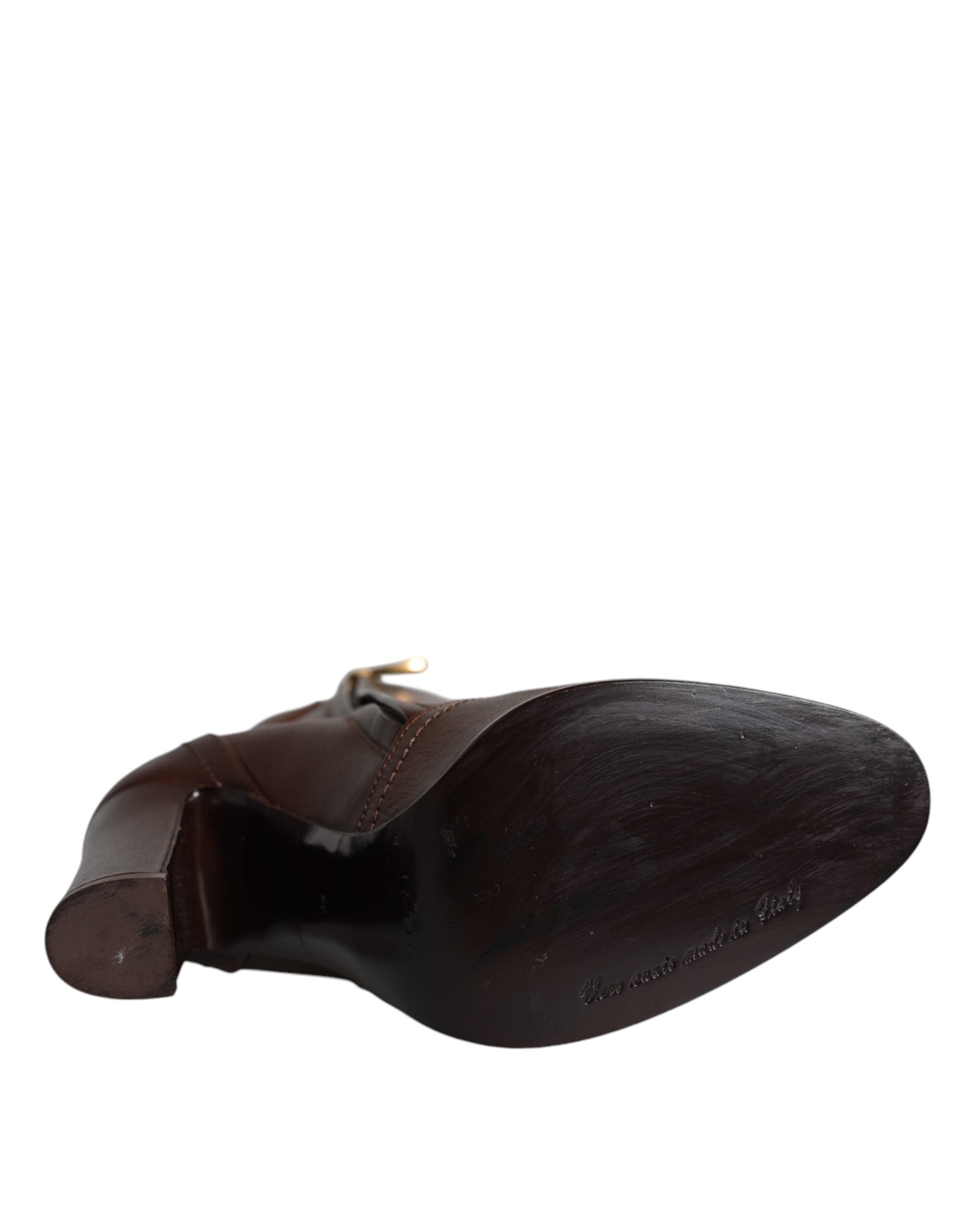 Brown leather mid-calf heels boots by Dolce & Gabbana, stylish ankle-length shoes with a sleek design and pointed toe.