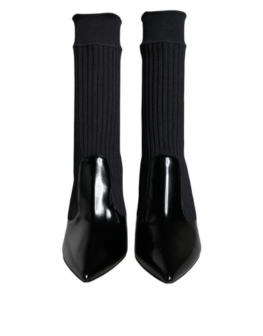 Black stretch stilettos booties with sock-like design by Dolce & Gabbana, featuring sleek pointed toes and high stiletto heels.