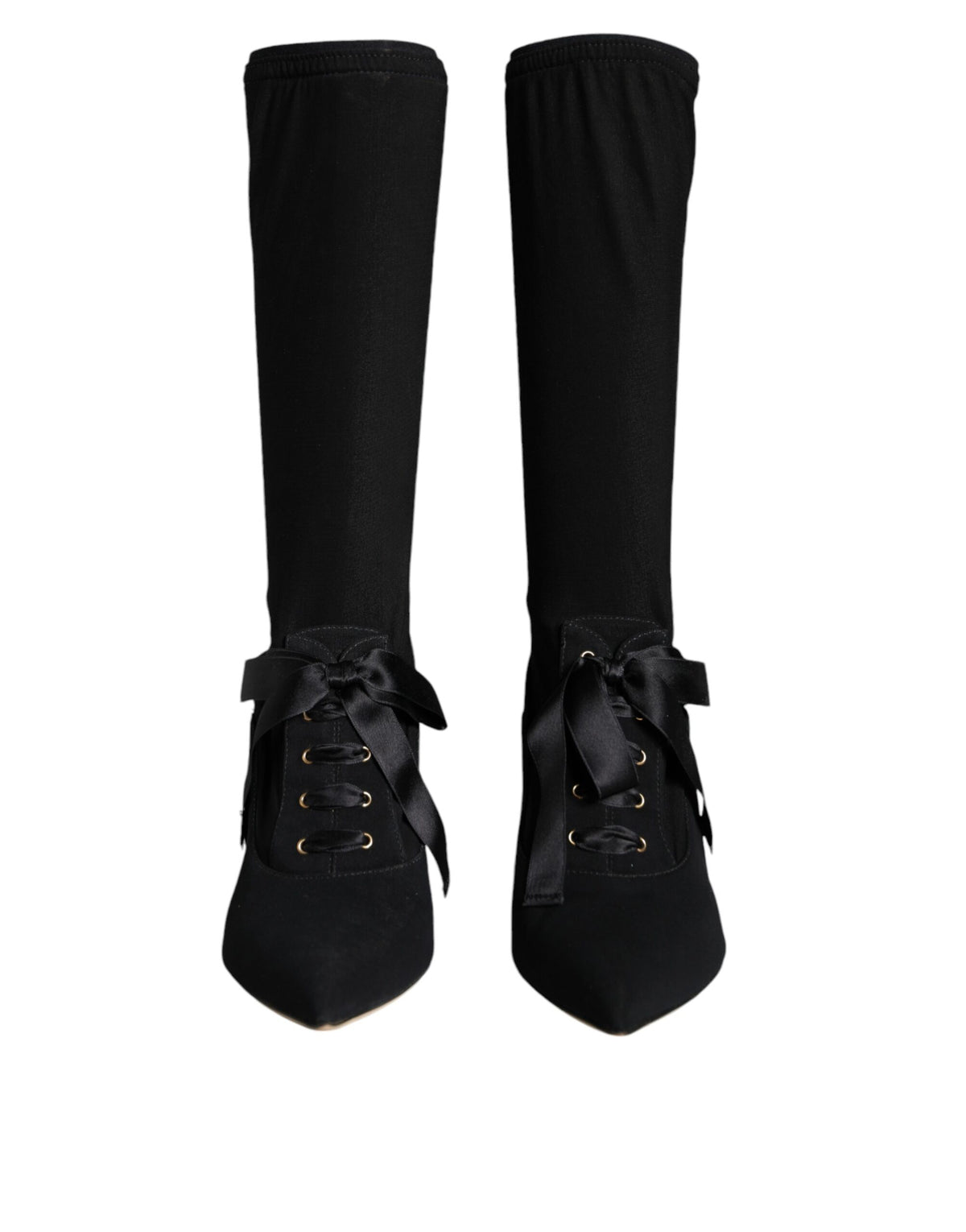 Black Dolce & Gabbana stiletto heels and mid-calf boots displayed, showcasing sleek design and high-heeled footwear style.