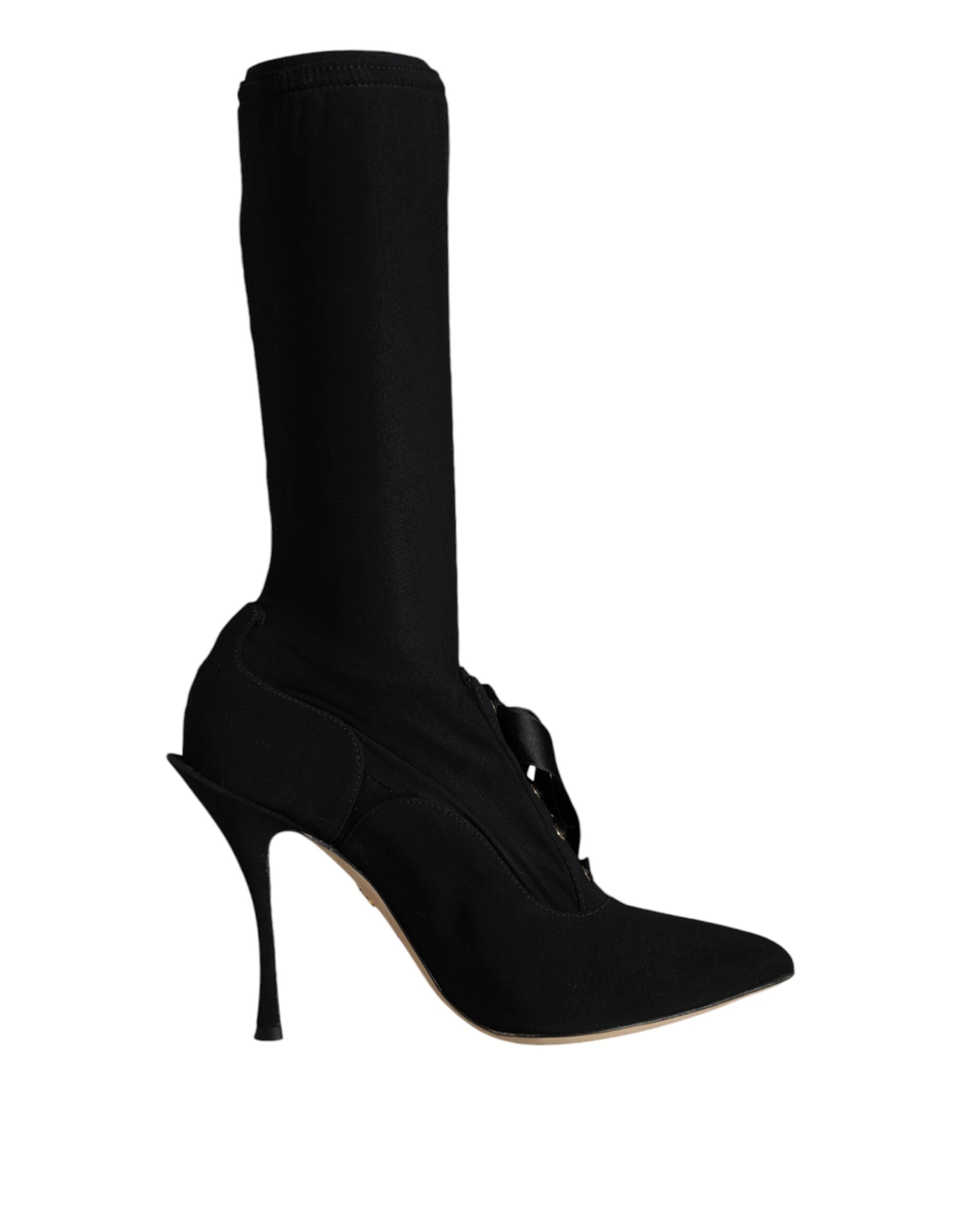 Black Dolce & Gabbana stiletto heels and mid-calf boots showing sleek leather design and pointed toes on a white background.