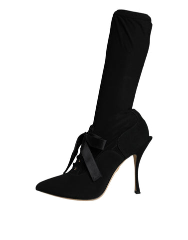 Black Dolce & Gabbana stiletto heels mid calf boots with pointed toes and sleek design, perfect for stylish footwear.