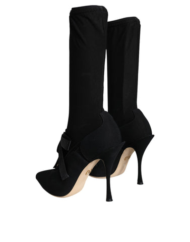 Dolce & Gabbana black stiletto heel mid-calf boots showcasing sleek leather design and pointed toe.