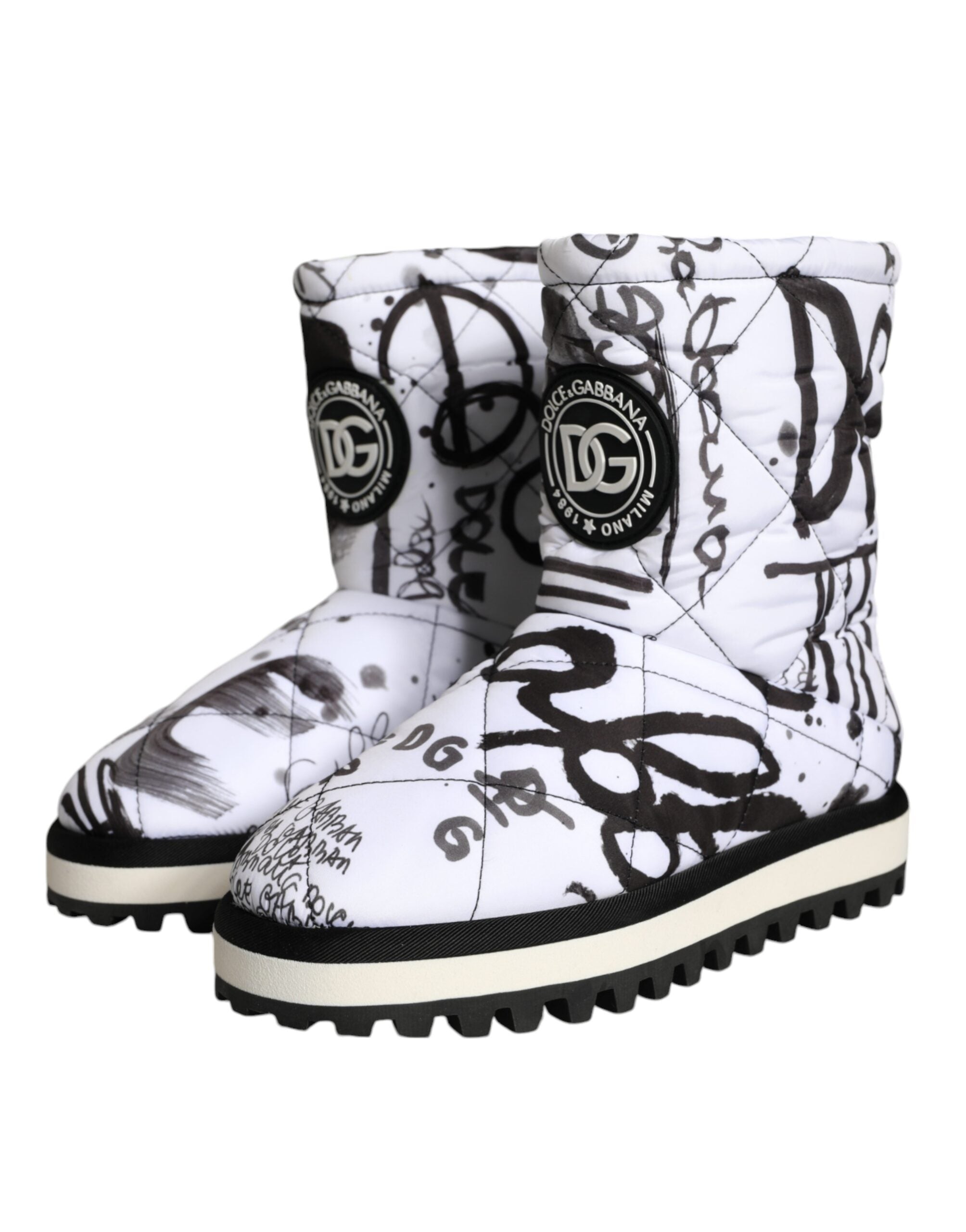 White padded Dolce & Gabbana logo print mid-calf boots with a sleek design and chunky sole, stylish and comfortable footwear.