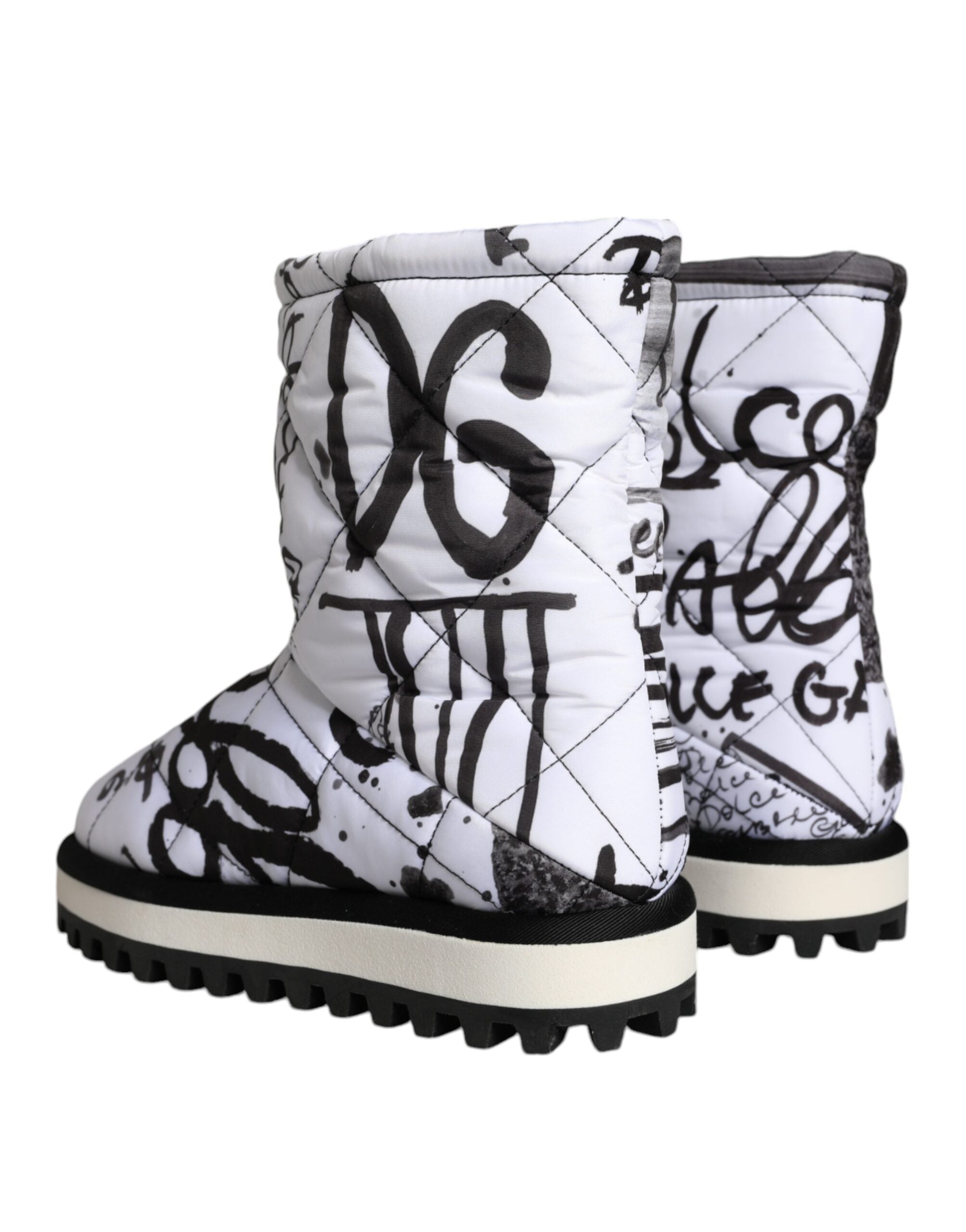 White padded logo print mid-calf boots by Dolce & Gabbana, featuring a sleek design and comfortable mid-calf length.