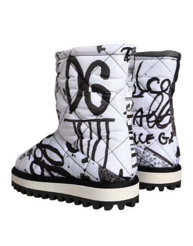White padded logo print mid-calf boots by Dolce & Gabbana, featuring a sleek design and comfortable mid-calf length.
