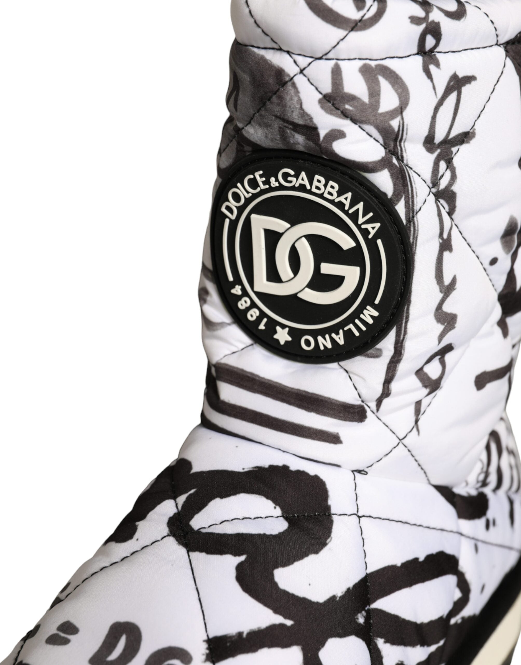 White padded logo print mid-calf boots by Dolce & Gabbana, showcasing sleek design and stylish ankle-high footwear.