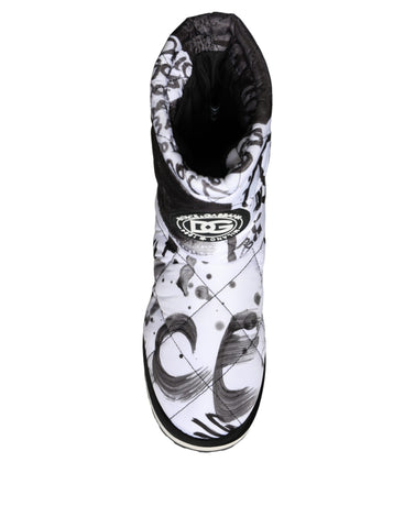 White padded logo print mid-calf boots by Dolce & Gabbana with a sleek design and textured sole, ideal for stylish winter wear.