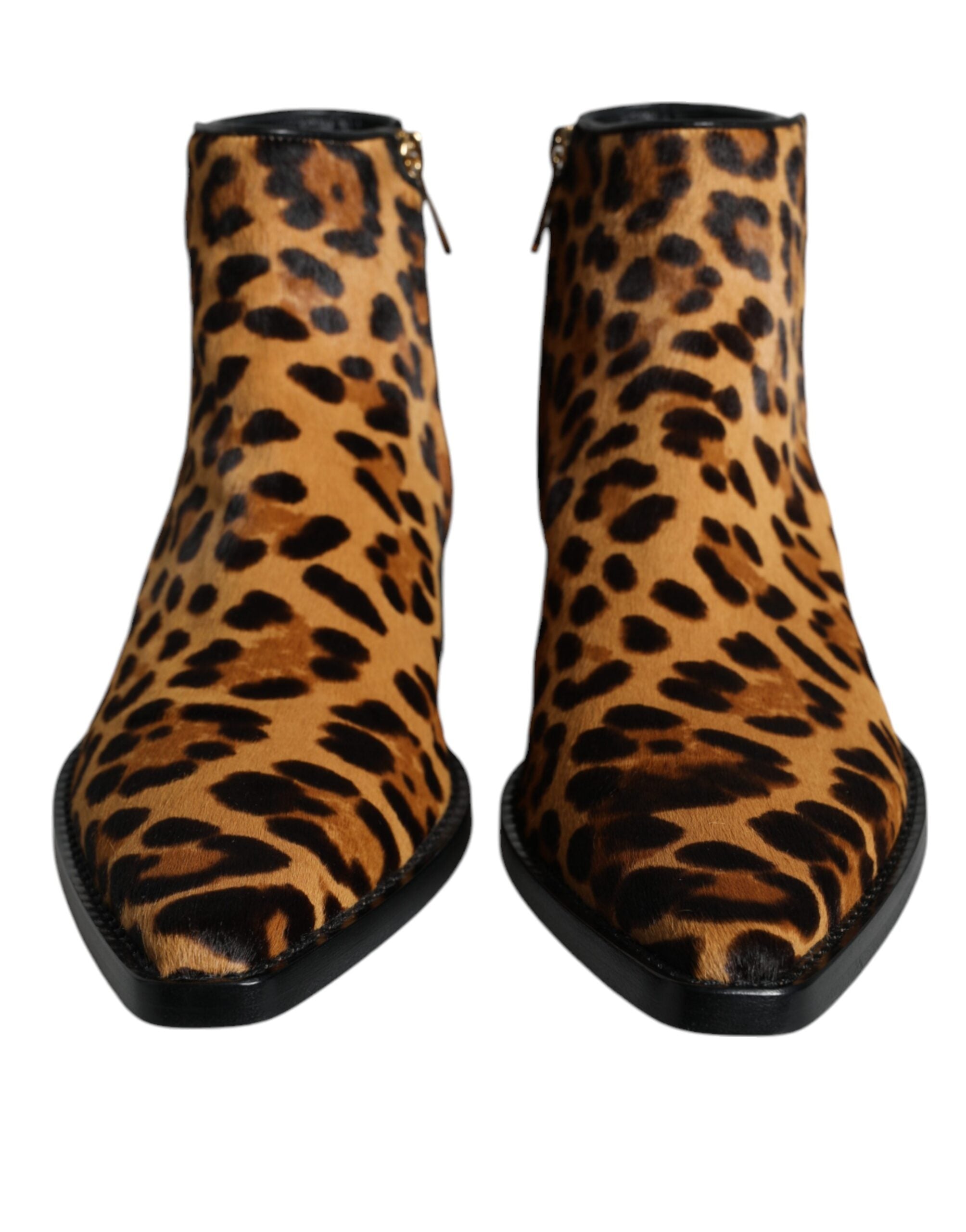 Brown leopard calf fur ankle boots by Dolce & Gabbana, featuring pointed toes and chunky heels.