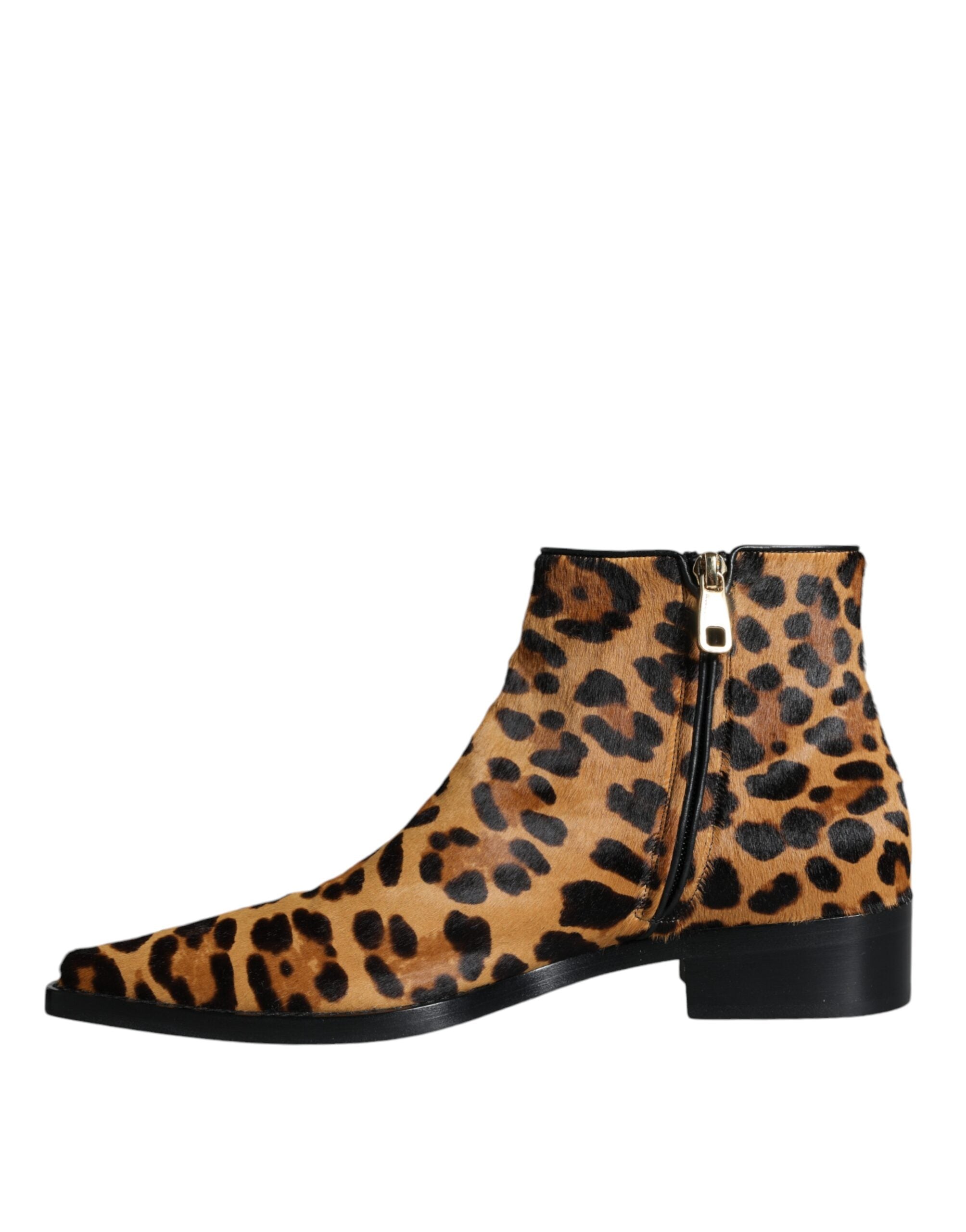 Brown leopard calf fur ankle boots by Dolce & Gabbana with pointed toes and block heels, stylish and luxurious footwear.