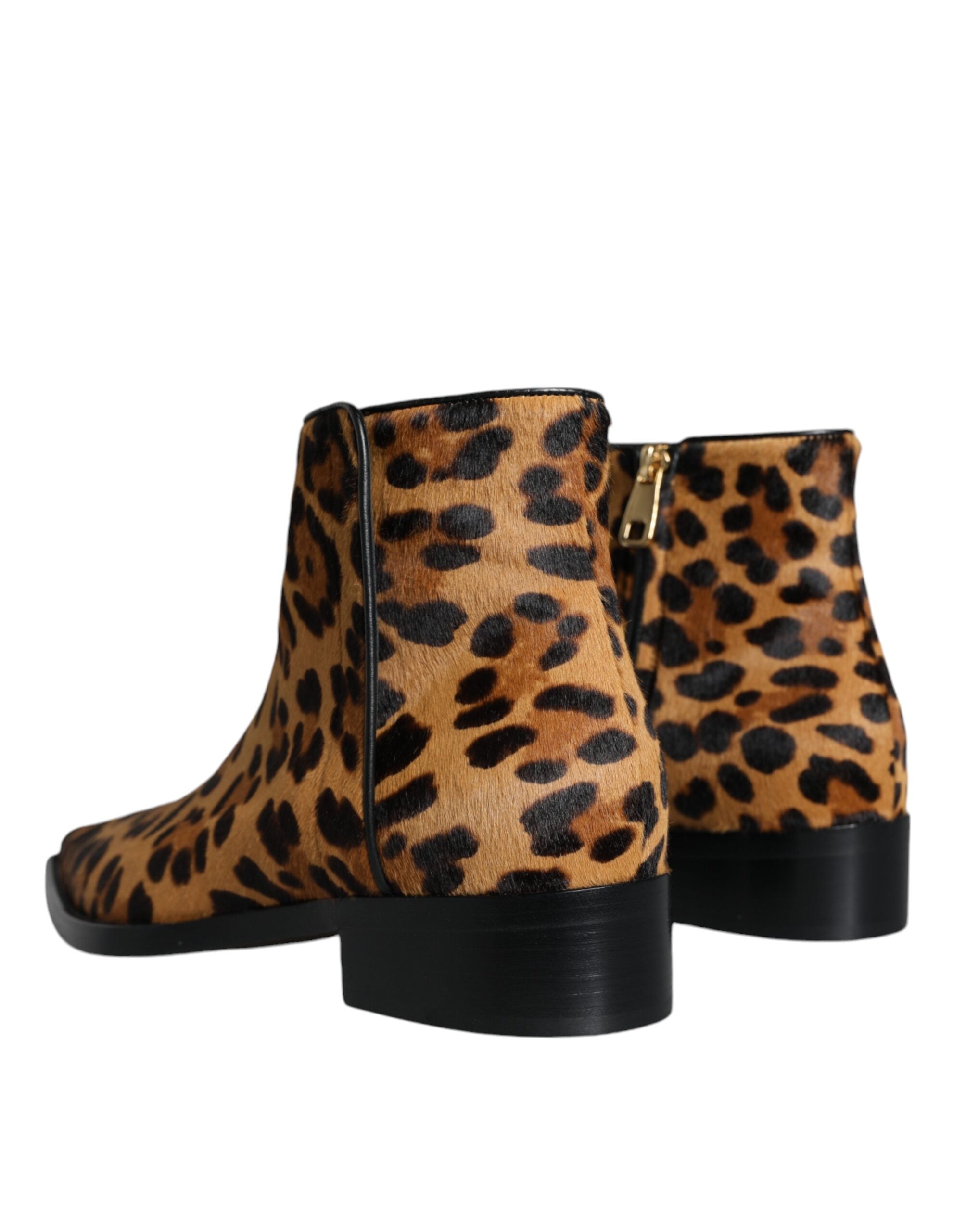 Dolce & Gabbana brown leopard calf fur ankle boots with pointed toes and block heels, showcasing stylish animal print footwear.