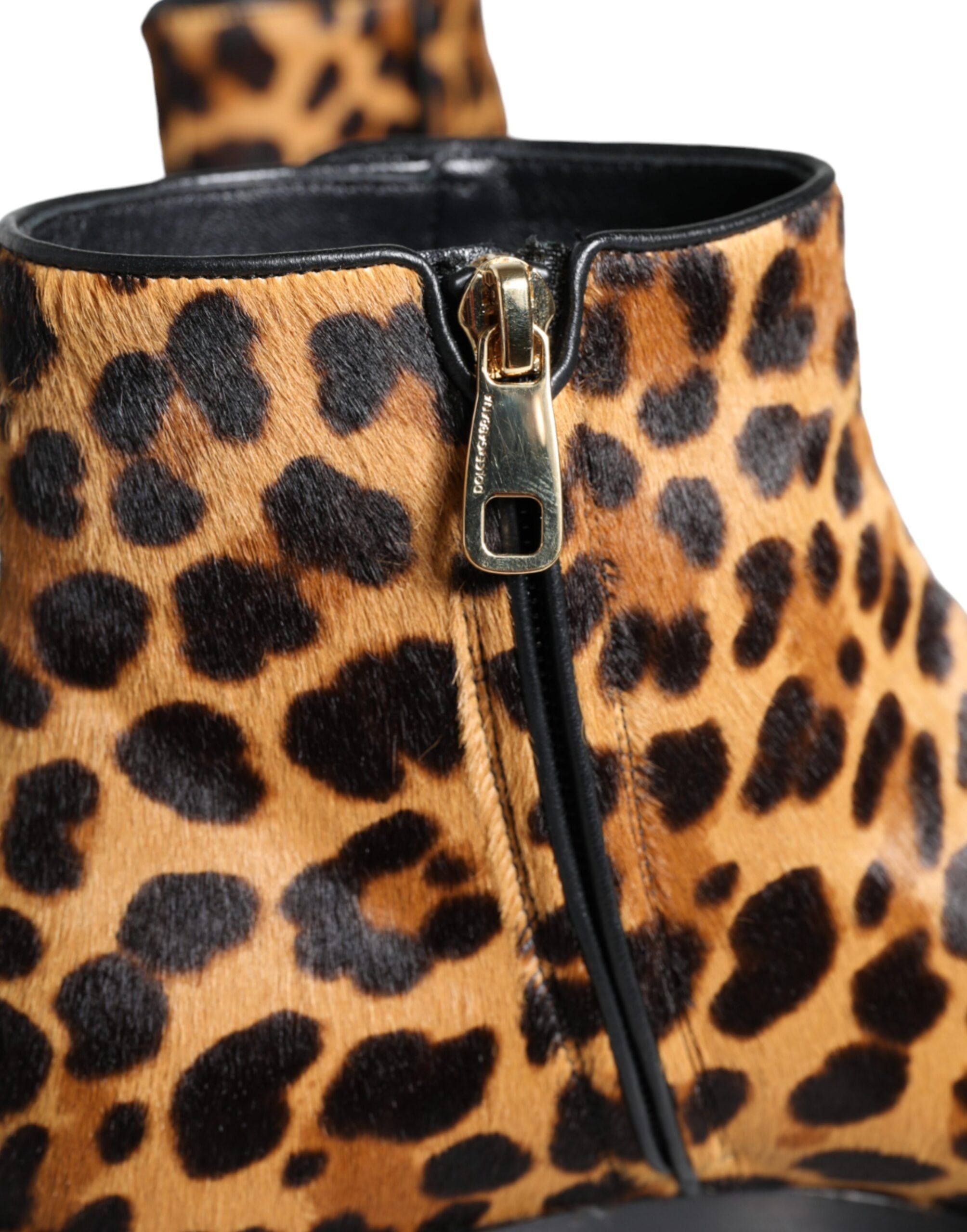 Brown leopard calf fur ankle boots by Dolce & Gabbana featuring pointed toes and block heels.