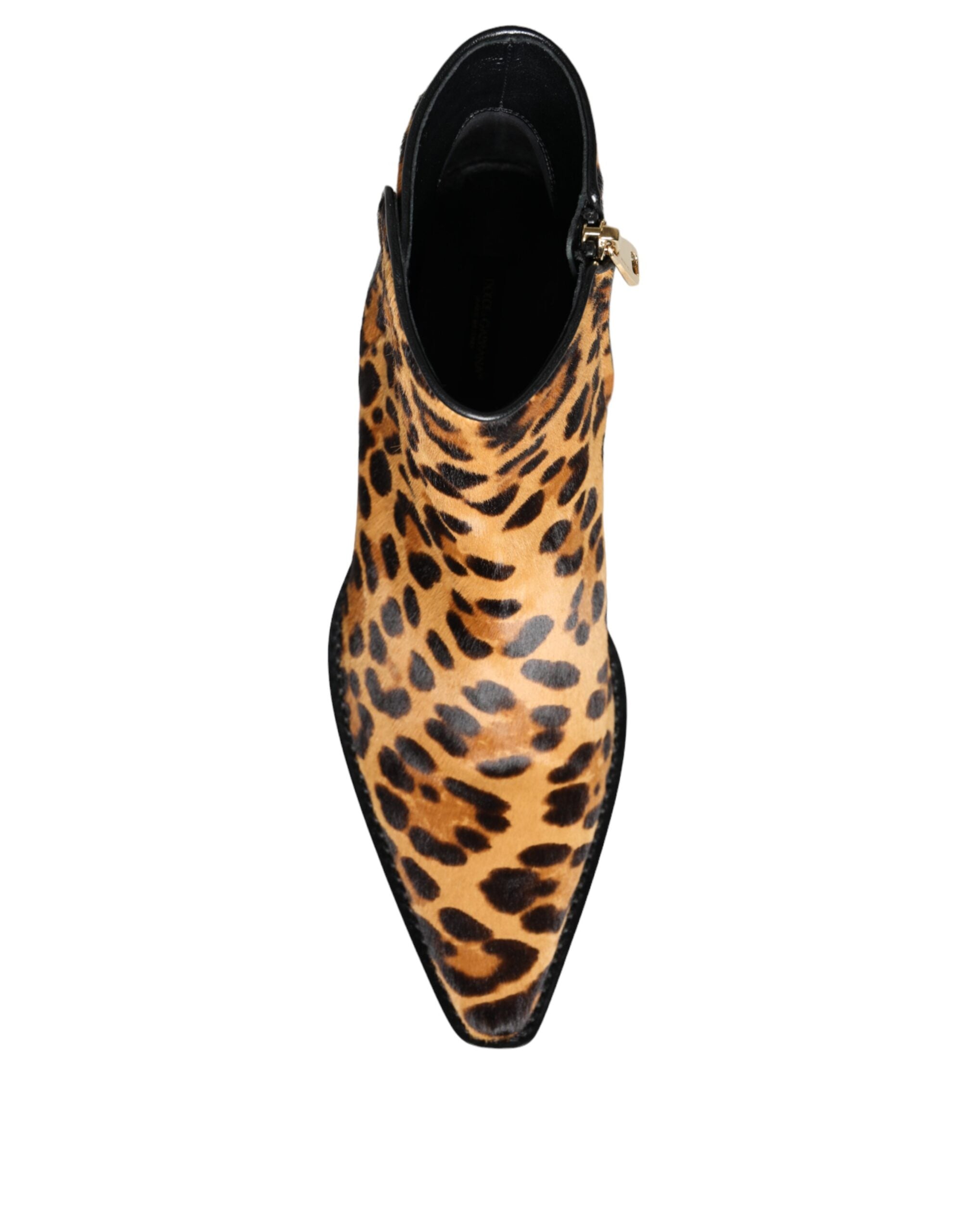 Brown leopard calf fur ankle boots by Dolce & Gabbana with pointed toes and chunky heels, showcasing stylish animal print footwear.