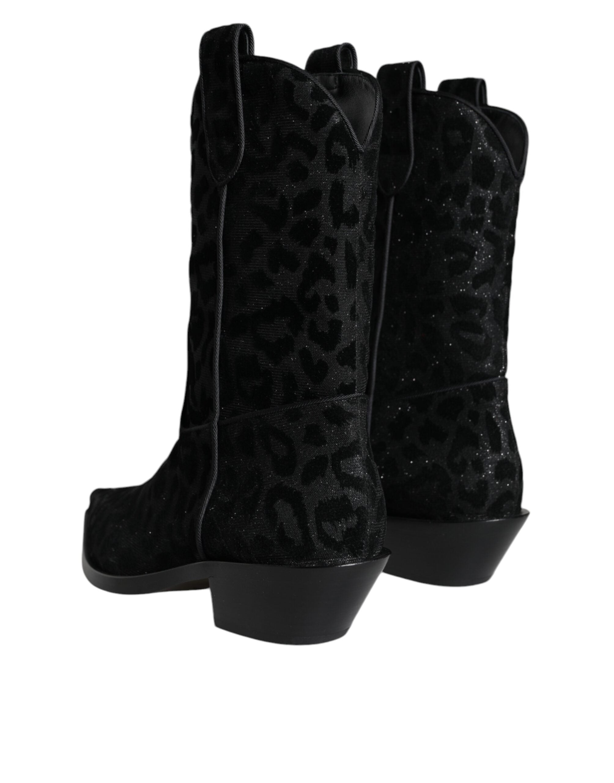 Black and gray leopard-print cowboy boots by Dolce & Gabbana with pointed toes and Western-style stitching.