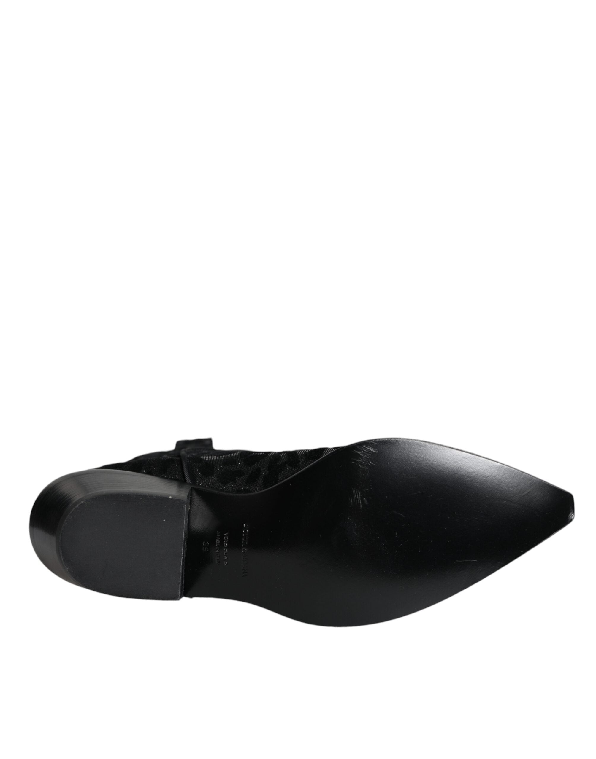 Dolce & Gabbana black and gray leopard cowboy boots with pointed toes and Western style stitching.